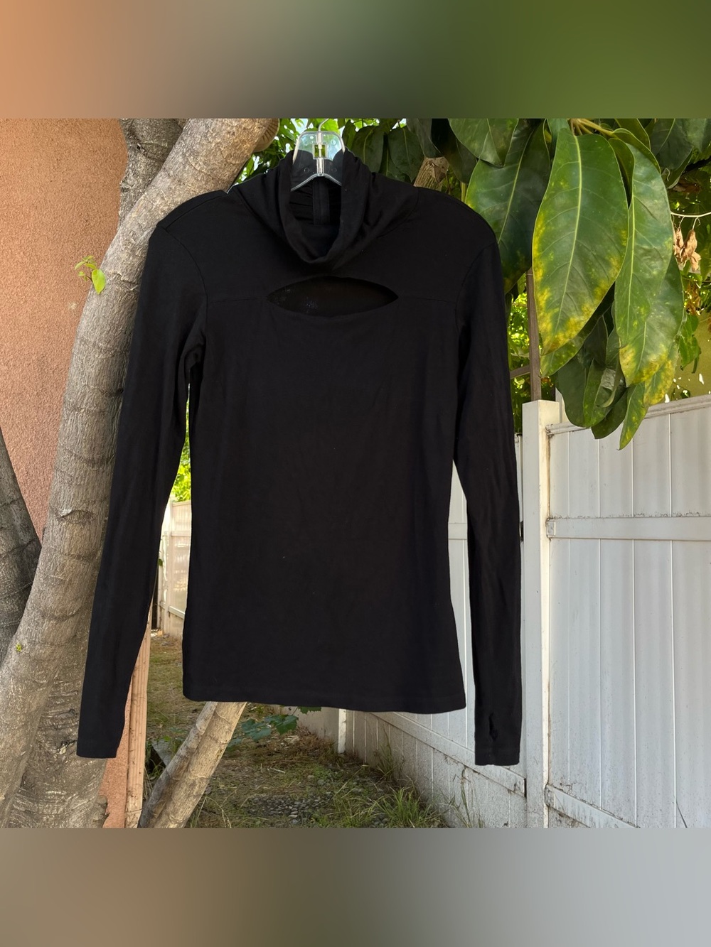 NÖR Denmark Cutout Mock Neck Top in Black.